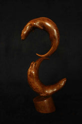 Bronze sculpture of two otters.