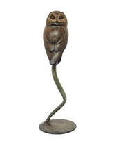 Bronze owl sculpture on a white background