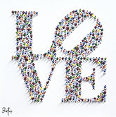 Colorful 'BE' artwork with a white background