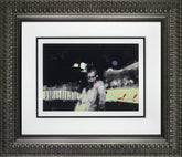 Framed artwork with a black and white abstract design on a white background