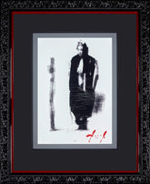 Framed artwork of a stylized figure with a cross, signed by the artist.