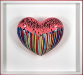Heart-shaped 3D artwork with colourful design and black figures on a white background