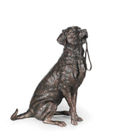 Bronze statue of a dog on a white background