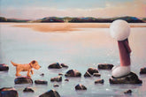 Man and dog stood on rocks at the beach