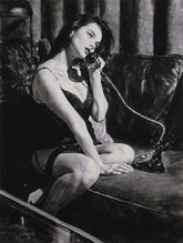 Woman sitting on a couch holding a phone in a black and white painting.