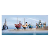 Colorful boats and houses on a beach with a lighthouse against a blue sky.