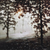 Deer in a misty forest with trees and soft light
