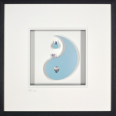Framed artwork of a yin yang symbol with people inside, on a white background.