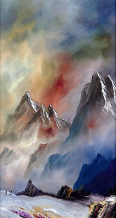 Framed painting of a mountain landscape with colourful sky