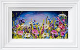 Framed artwork of colorful flowers with a white frame