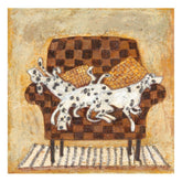 Two Dalmatian dogs on a checkered couch with a woven basket.