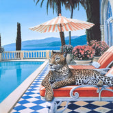 Leopard lounging on a sun lounger by a pool with a scenic background