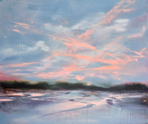 beach at sunset with pink and orange clouds.