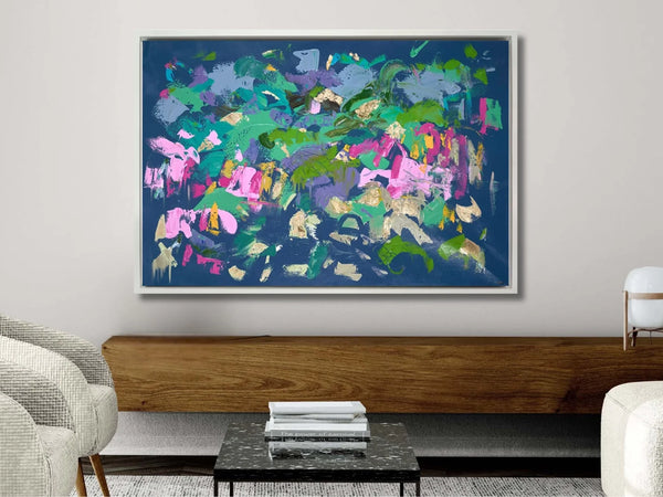 Abtract Artwork on white wall above wooden side board