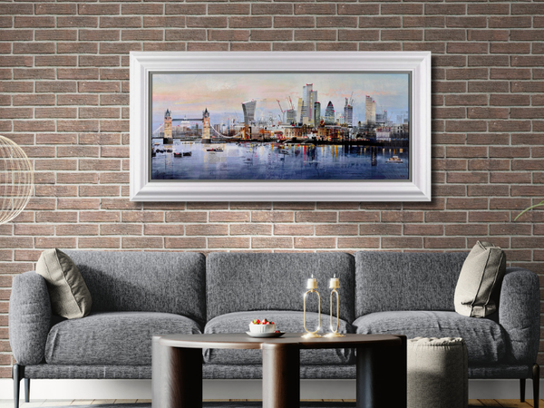 Cityscape artwork on brick wall above grey sofa