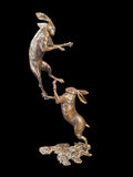 Bronze sculpture of two Hares boxing