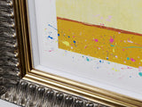 detail image of a yellow background with paint splatters.