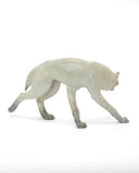 bronze sculpture of white fox standing