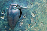 Bronze textured plaque with a blue bird on a stone wall