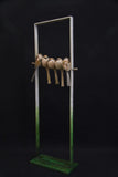 Sculpture of 5 birds in a frame.