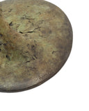 Bronze sculpture base featuring signature