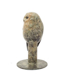 bronze sculpture of grey owl on post