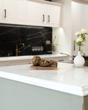 Bronze sculpture of walnut on wooden base in modern kitchen