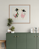 Green cabinet with decorative items and a framed artwork of roosters on a light gray wall.