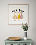 Framed artwork of four colorful ducks on a wall above a green cabinet with a vase and plate.
