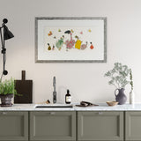 Framed artwork above a kitchen sink with decorative elements.