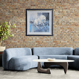 abstract oil painting of white horse on blue and grey background in black and gold frame on brick wall above a silver blue sofa
