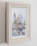 Framed artwork of a city street scene with Big Ben in the background.