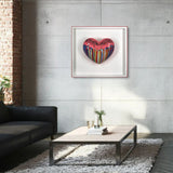 Modern living room with a colorful heart-shaped artwork on the wall.