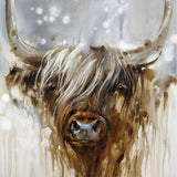 Framed artwork of a highland cow in a snowy landscape