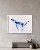 Framed abstract whale painting on a wall above a console table with decorative vases.