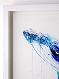 Framed artwork of a blue whale tail on a white background
