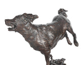 Bronze sculpture of a dog on a white background