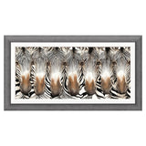 Framed artwork of zebras' heads with a gray frame on a white background