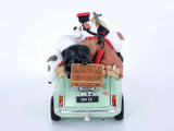 A mint green toy car shown from the rear, loaded with cartoon animals including a black dog, white sheep, and a brown cow, on a clean white background.