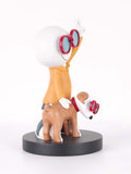A stylized figurine of a white-headed character wearing red-framed glasses and an orange shirt, standing on a black circular base while holding a brown dog with matching red-framed glasses, photographed on a clean white background.