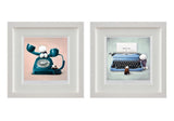 Two framed art prints displayed side by side on a white background. The left print shows a retro teal rotary telephone with white cartoon ears on a pale pink background.