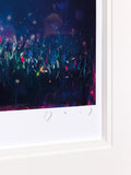 A framed art print featuring a dark, colorful abstract scene with tall grass-like forms in deep blue, purple, black, and pink tones, with a wide white mat and a white frame border visible.