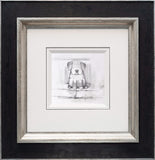 Framed black and white drawing of a dog inside a square border