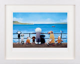 Framed artwork of dogs on a pier with a scenic background