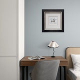 Framed sketch featuring a love heart in a bedroom above a desk with patterned chair