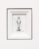 Framed black and white drawing of a figure on a white background