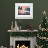 Decorated Christmas tree and fireplace with framed artwork on a green wall.
