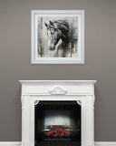 Framed artwork of a horse above a white fireplace with a black screen.