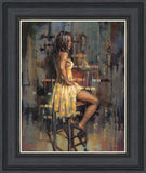 a woman sat on stool in yellow dress