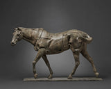 Bronze sculpture of a horse with a dark gray background